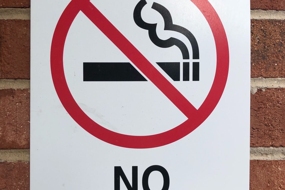 No smoking sign on a brick wall